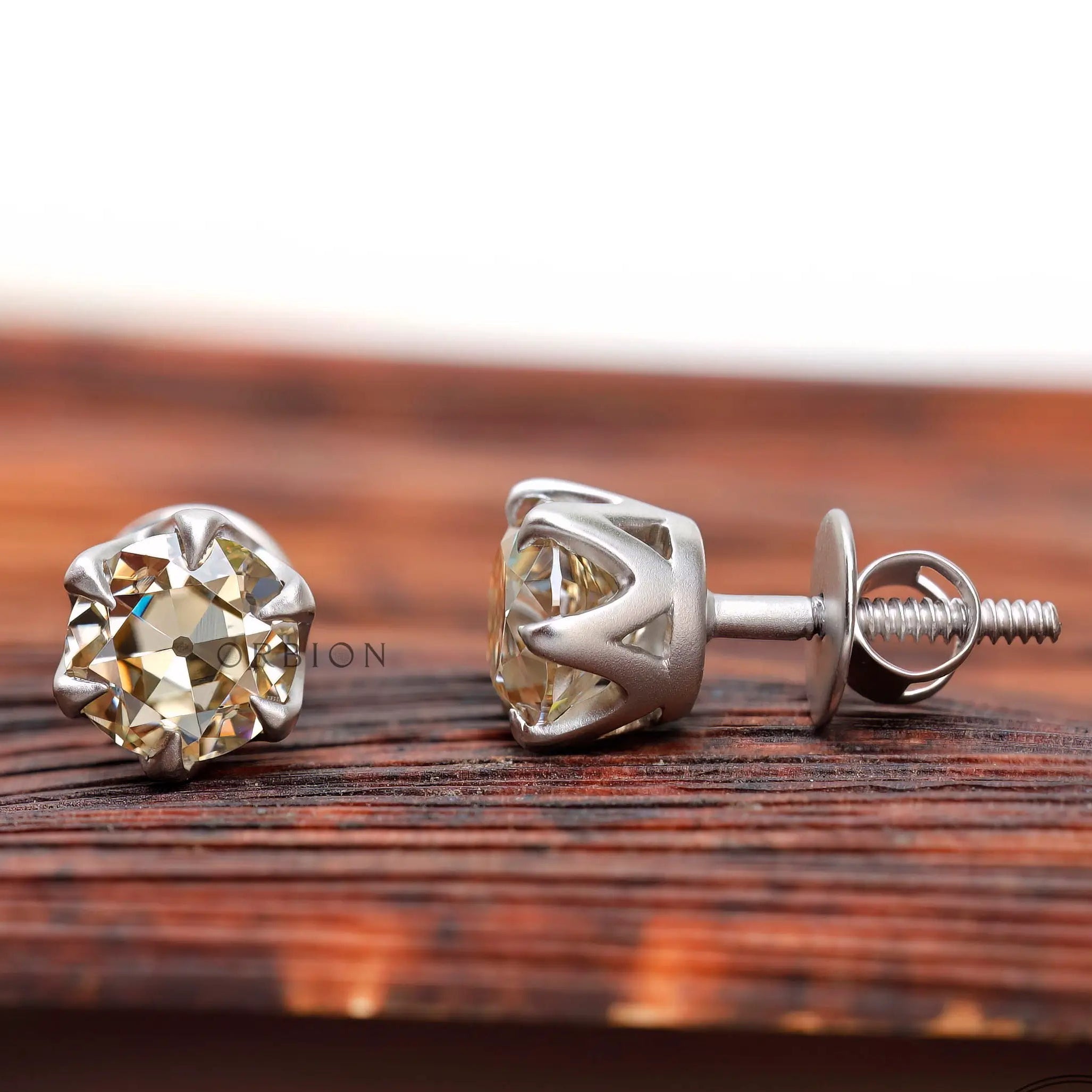 Classic round moissanite stud earrings close up detail
