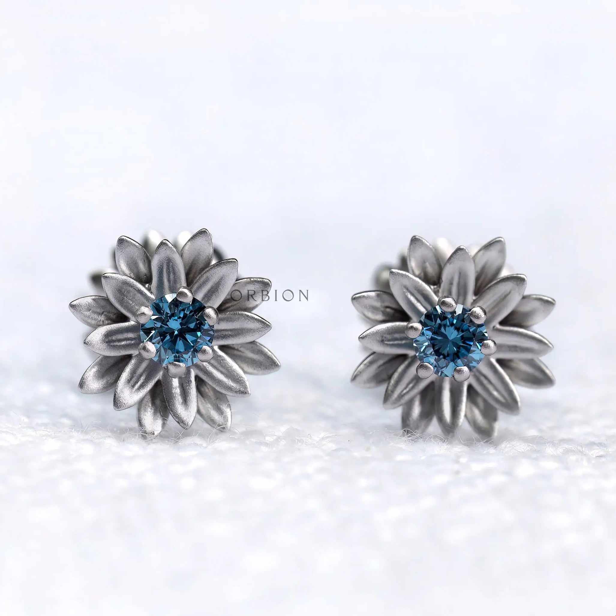 Lotus bloom blue lab diamond stud earrings in 10k white gold front view
