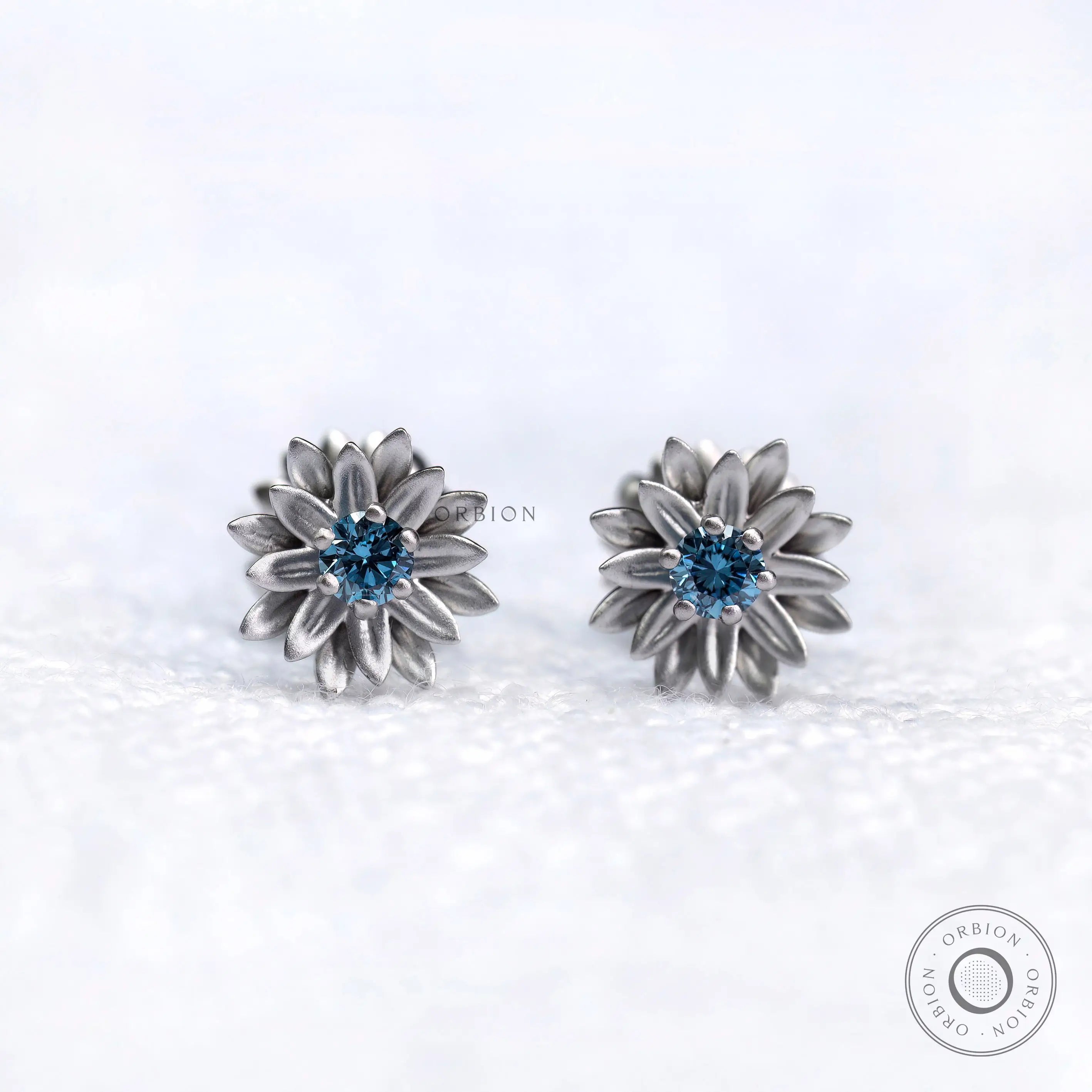 Lotus bloom blue lab diamond stud earrings in 10k white gold front view