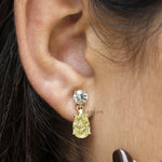 Graduation gift earrings with pear and round yellow lab diamonds in a modern teardrop gold design