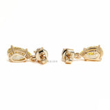 Teardrop dangle earrings featuring yellow lab diamonds, two stone stud design and 10k gold setting