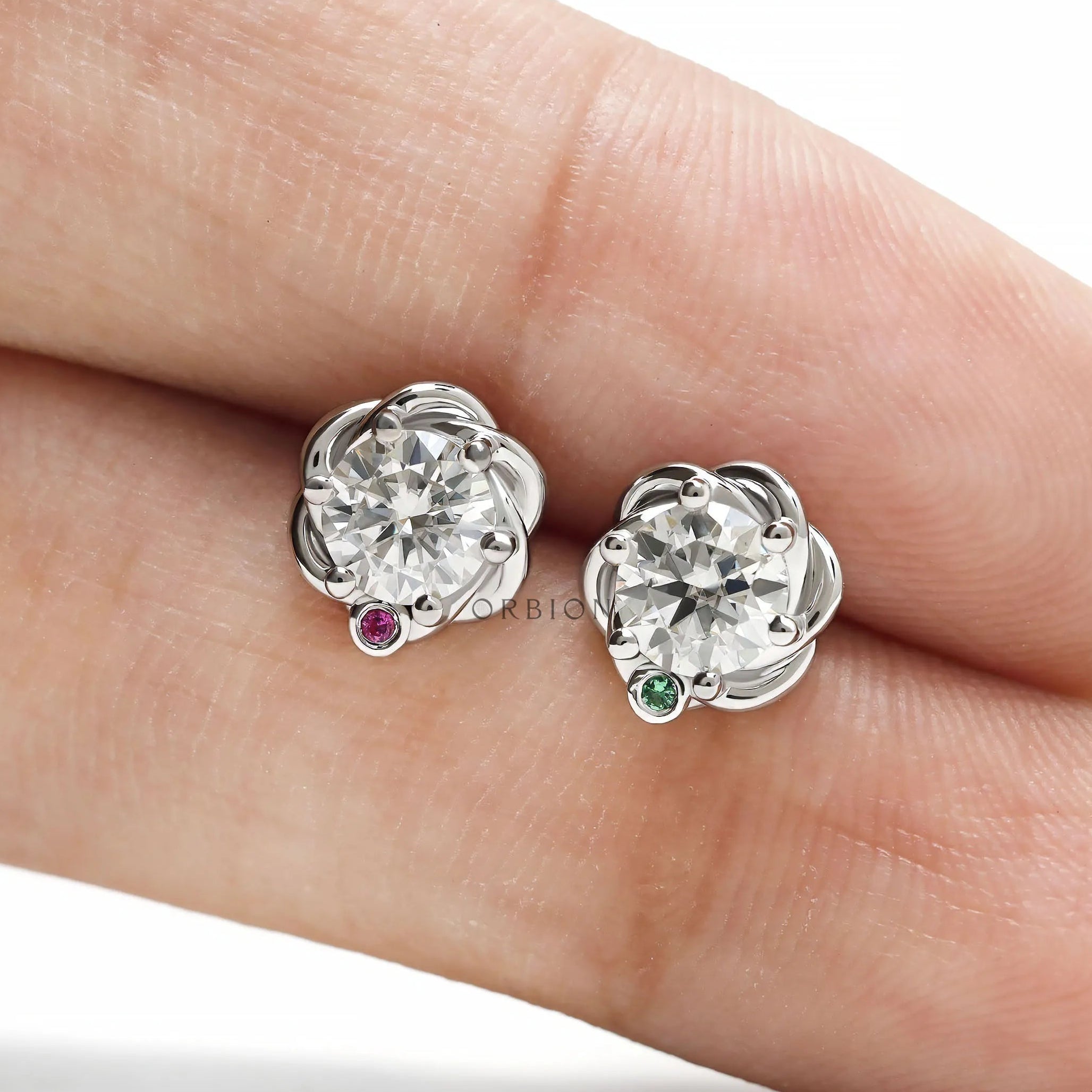 Round diamond birthstone stud earrings in 14k white gold with elegant braided statement design for women