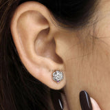 Moissanite stud earrings for women featuring round stones and a unique braided 14k white gold setting