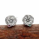 14k white gold round diamond stud earrings featuring a unique braided setting and modern wedding jewelry style