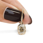 Elongated old mine cushion cut moissanite earrings featuring delicate yellow gold ear wires and timeless vintage design.