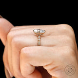Vintage style marquise engagement ring on hand 