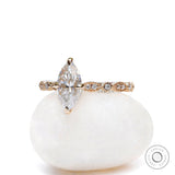 Marquise cut moissanite engagement ring in 14K yellow gold side view