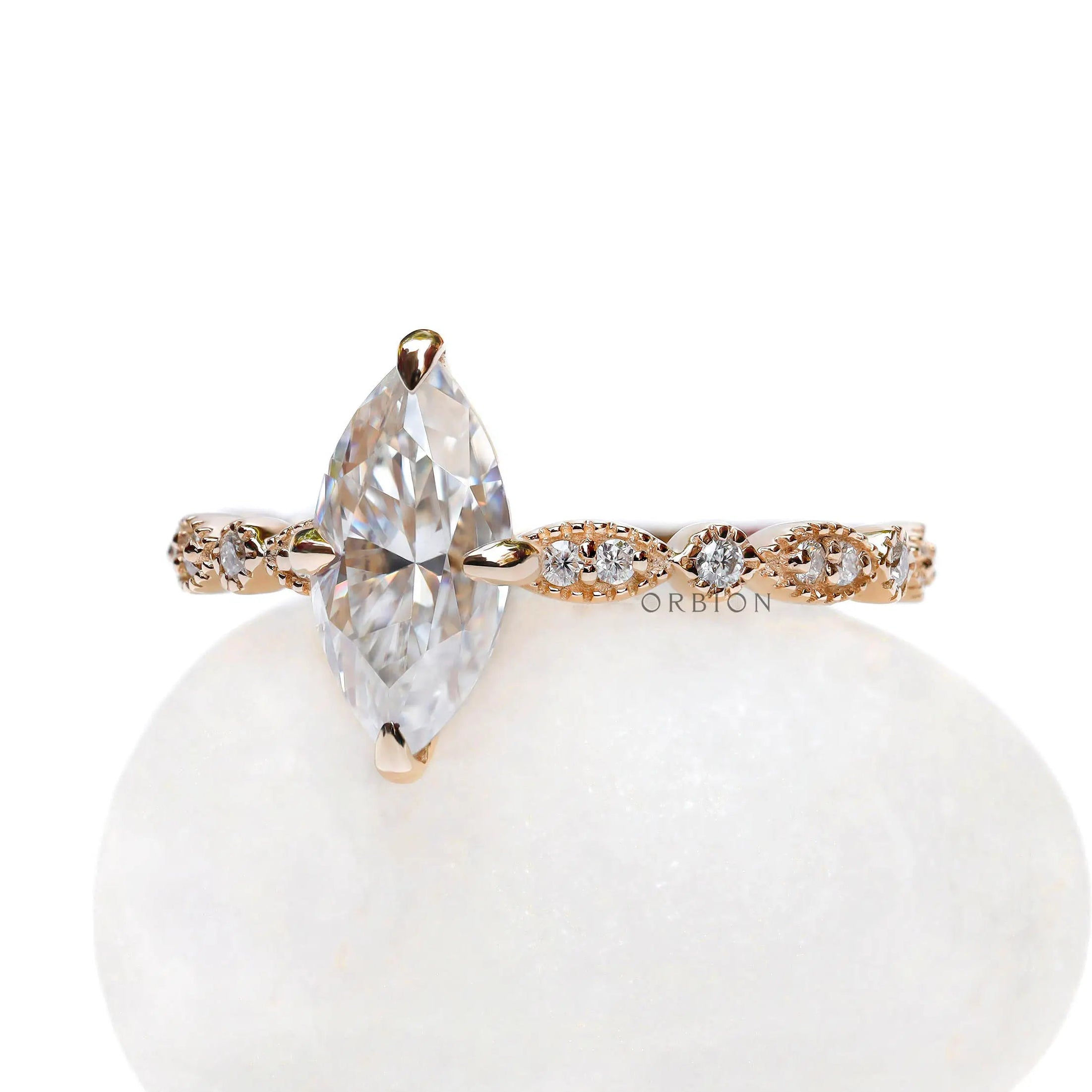 Marquise cut moissanite engagement ring in 14K yellow gold side view
