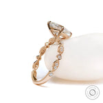 Detail of round accent stones on yellow gold band