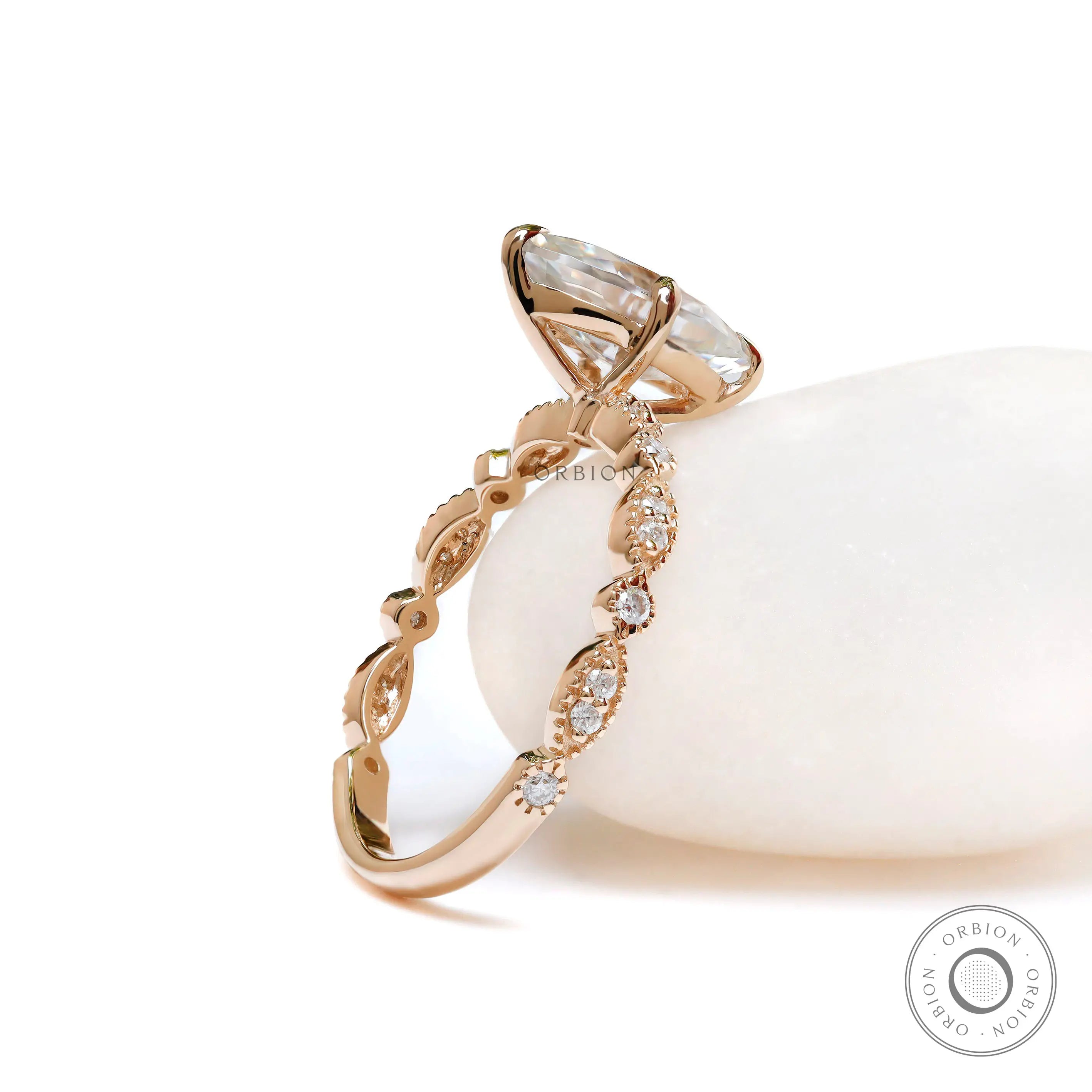 Detail of round accent stones on yellow gold band