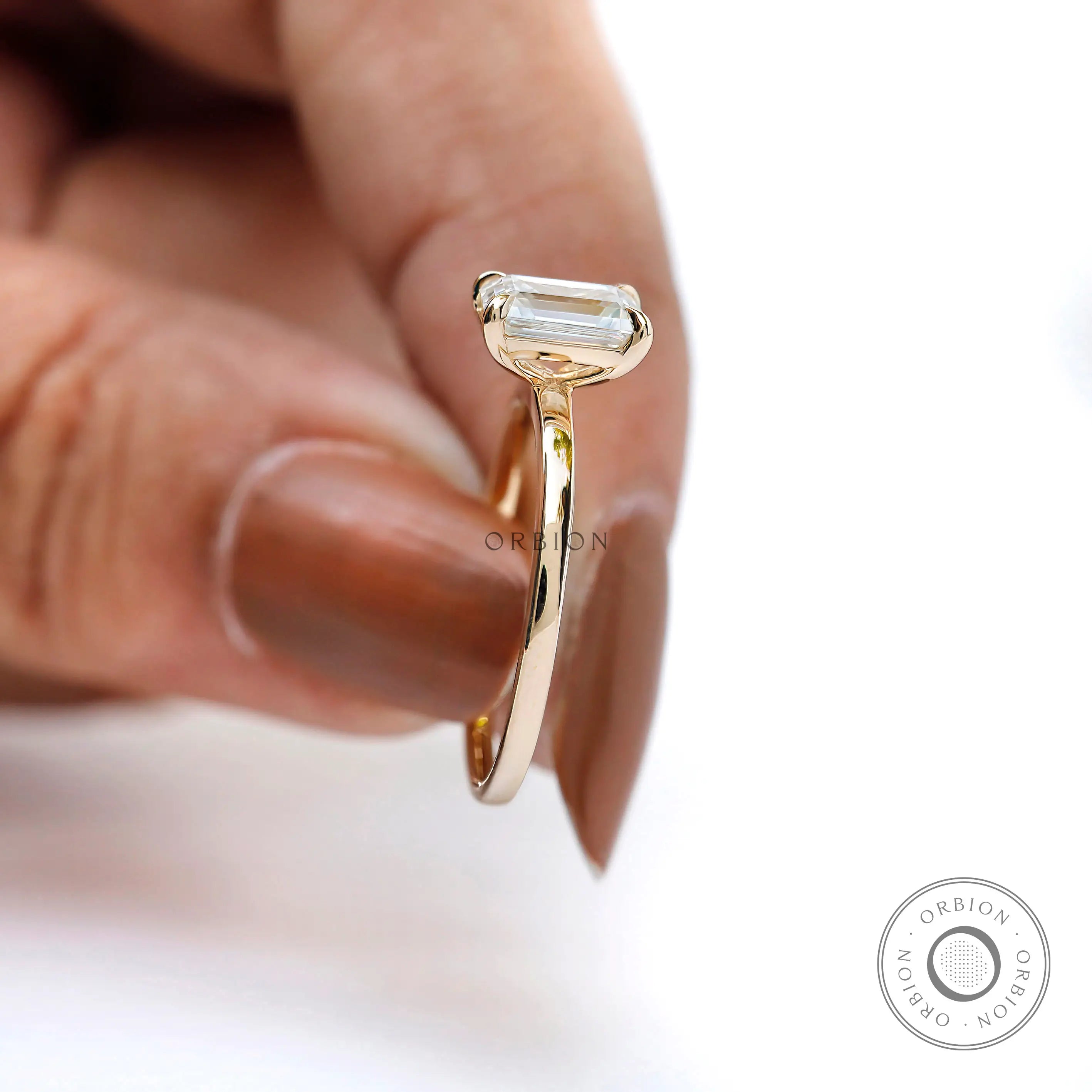 Colorless emerald cut moissanite ring martini setting