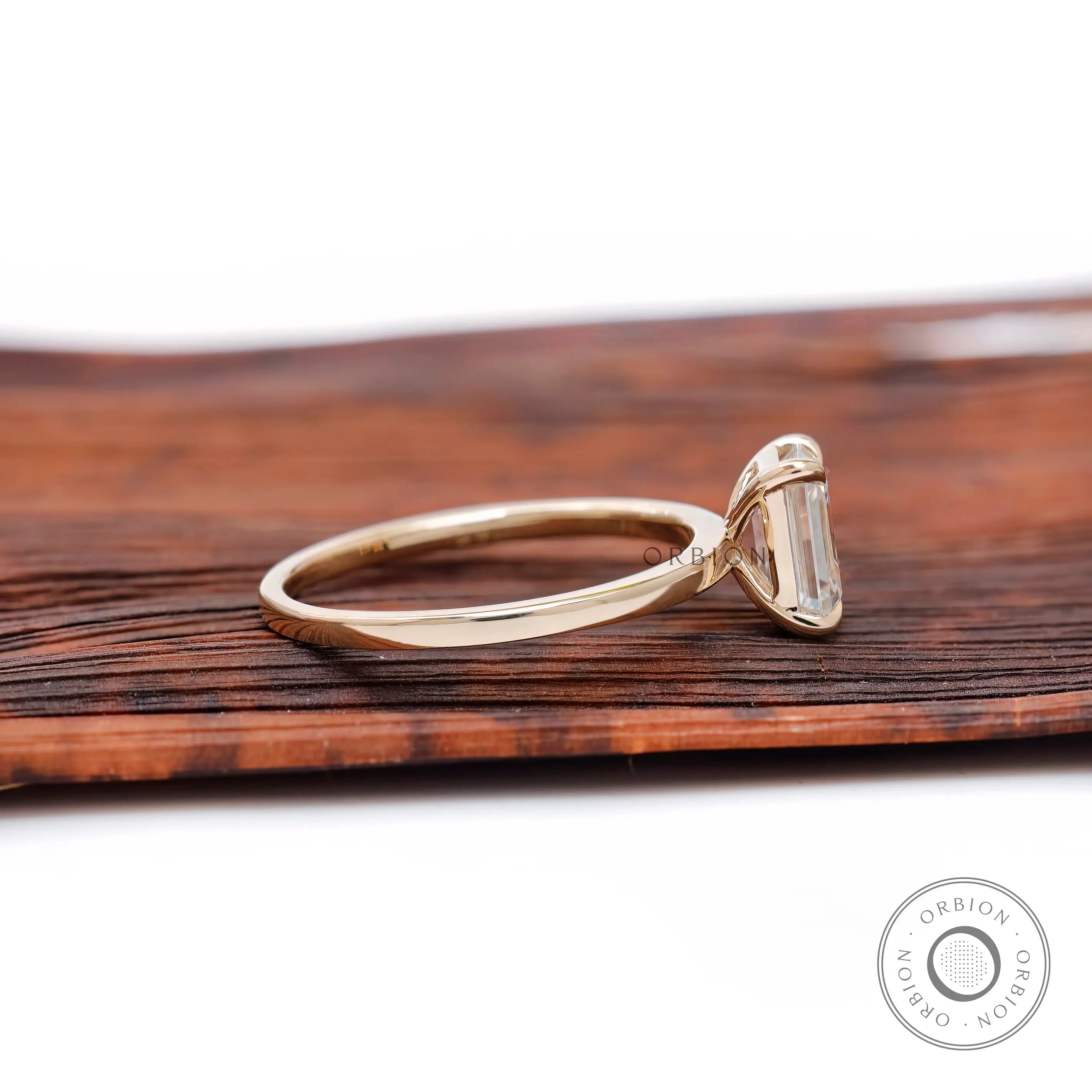 Yellow gold emerald solitaire ring side profile