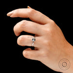 On hand top view emerald cut grey moissanite solitaire