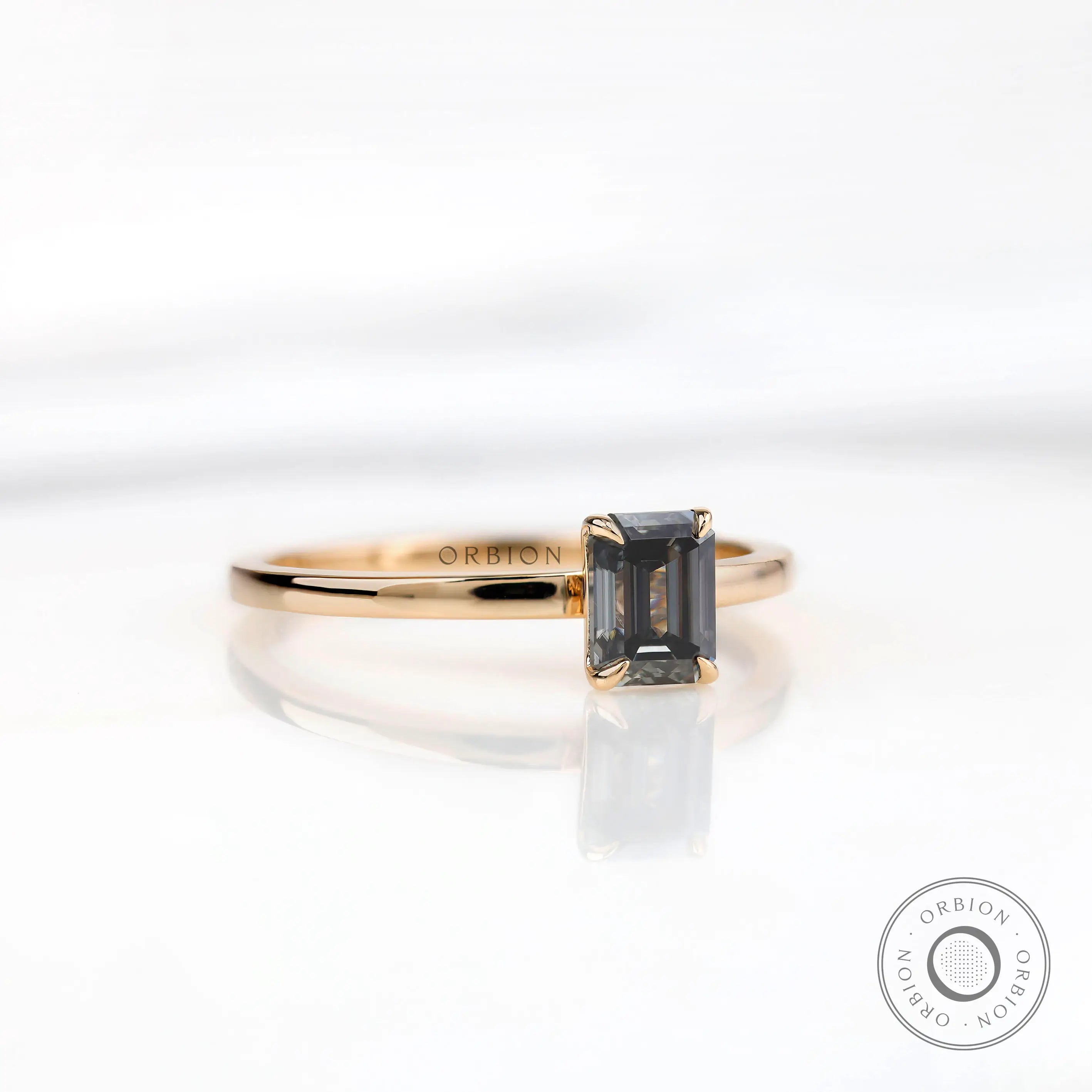 Yellow gold emerald cut engagement ring minimal style