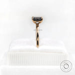 Side profile emerald cut moissanite ring yellow gold band
