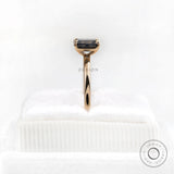 Side profile emerald cut moissanite ring yellow gold band