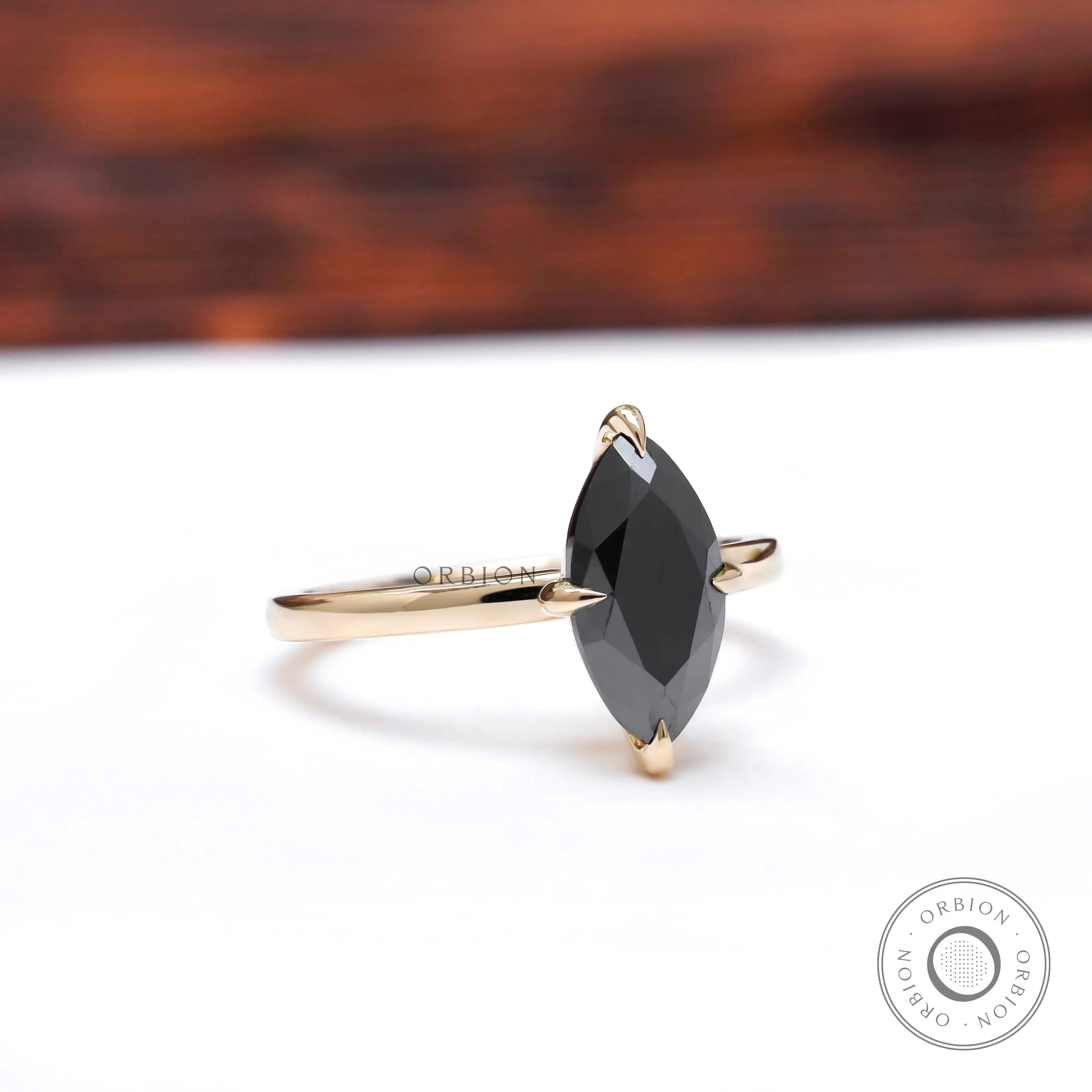 Angled view highlighting marquise black moissanite