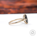 Side profile showing slim tapered solitaire band