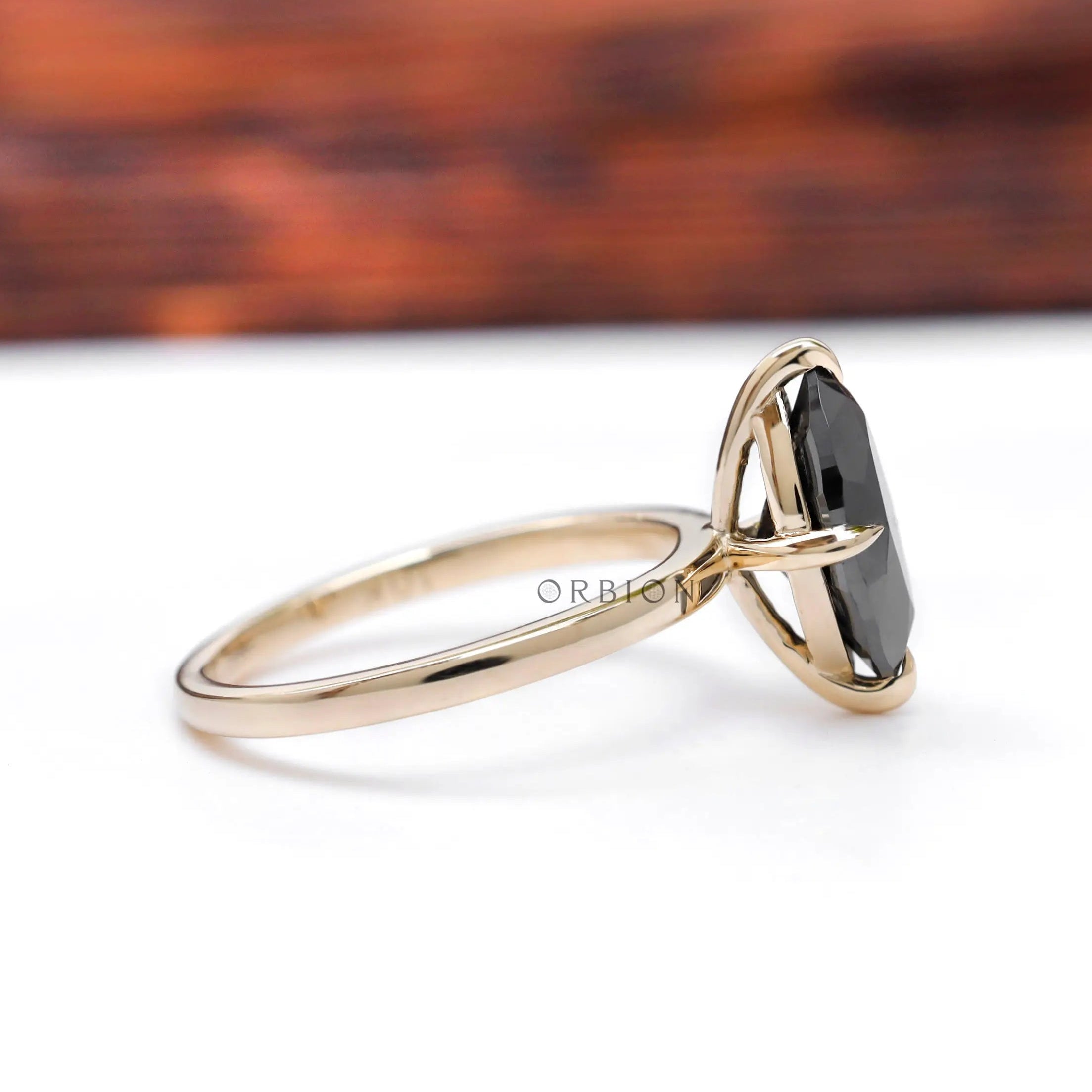 Side profile showing slim tapered solitaire band