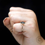 Side view of marquise moissanite ring worn