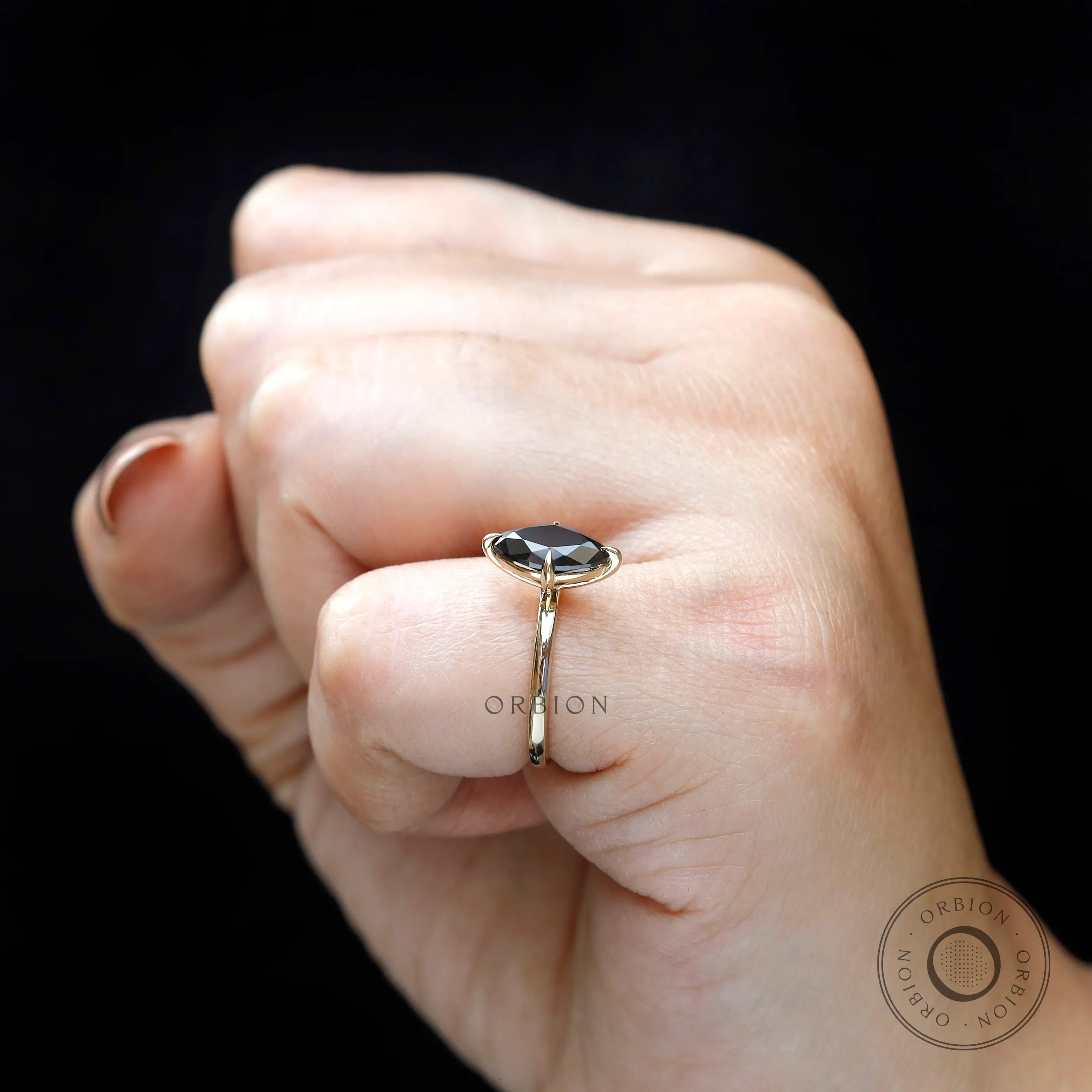 Side view of marquise moissanite ring worn