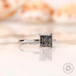 Grey moissanite solitaire ring with martini setting side view