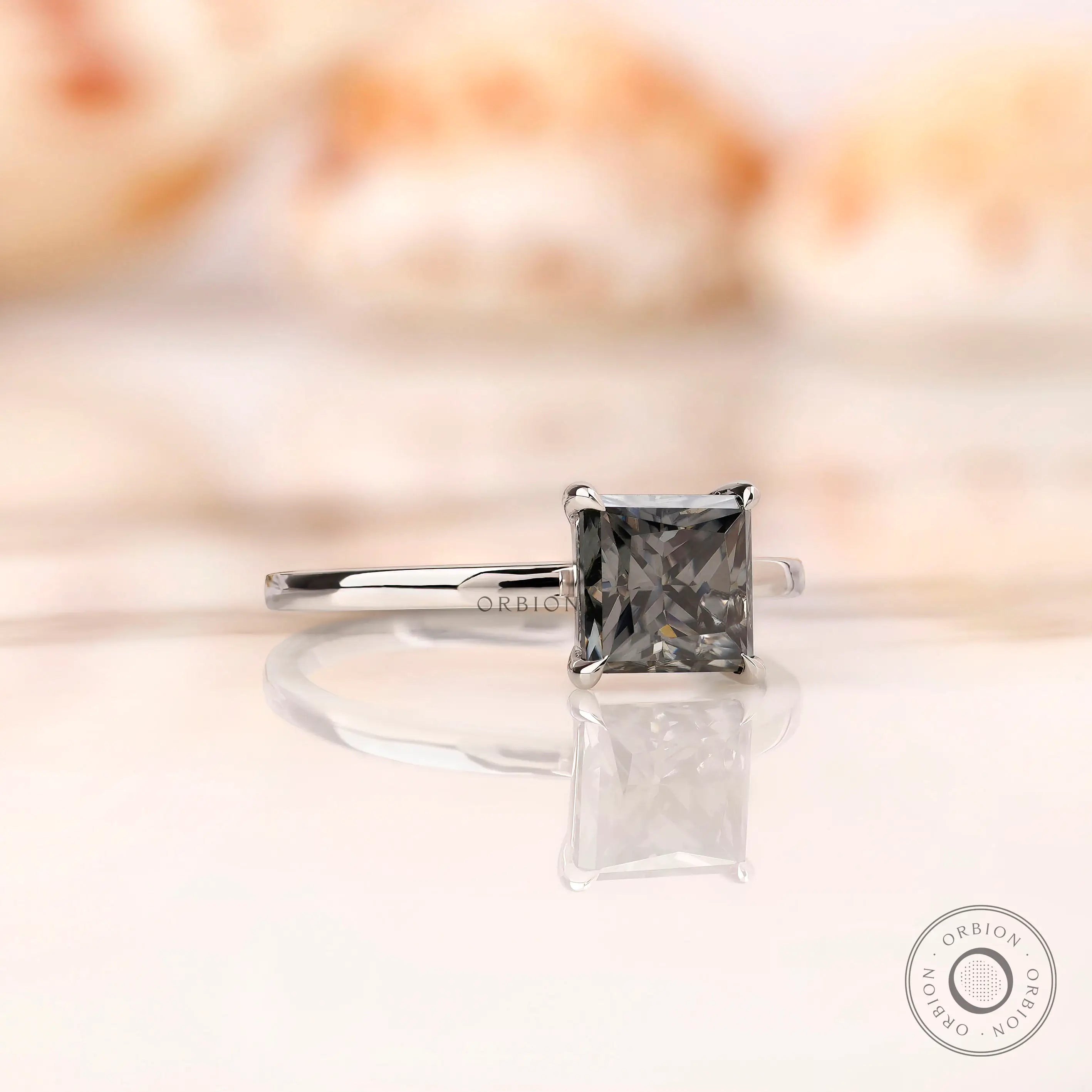 Grey moissanite solitaire ring with martini setting side view