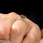 Minimalist black moissanite radiant cut engagement ring on hand