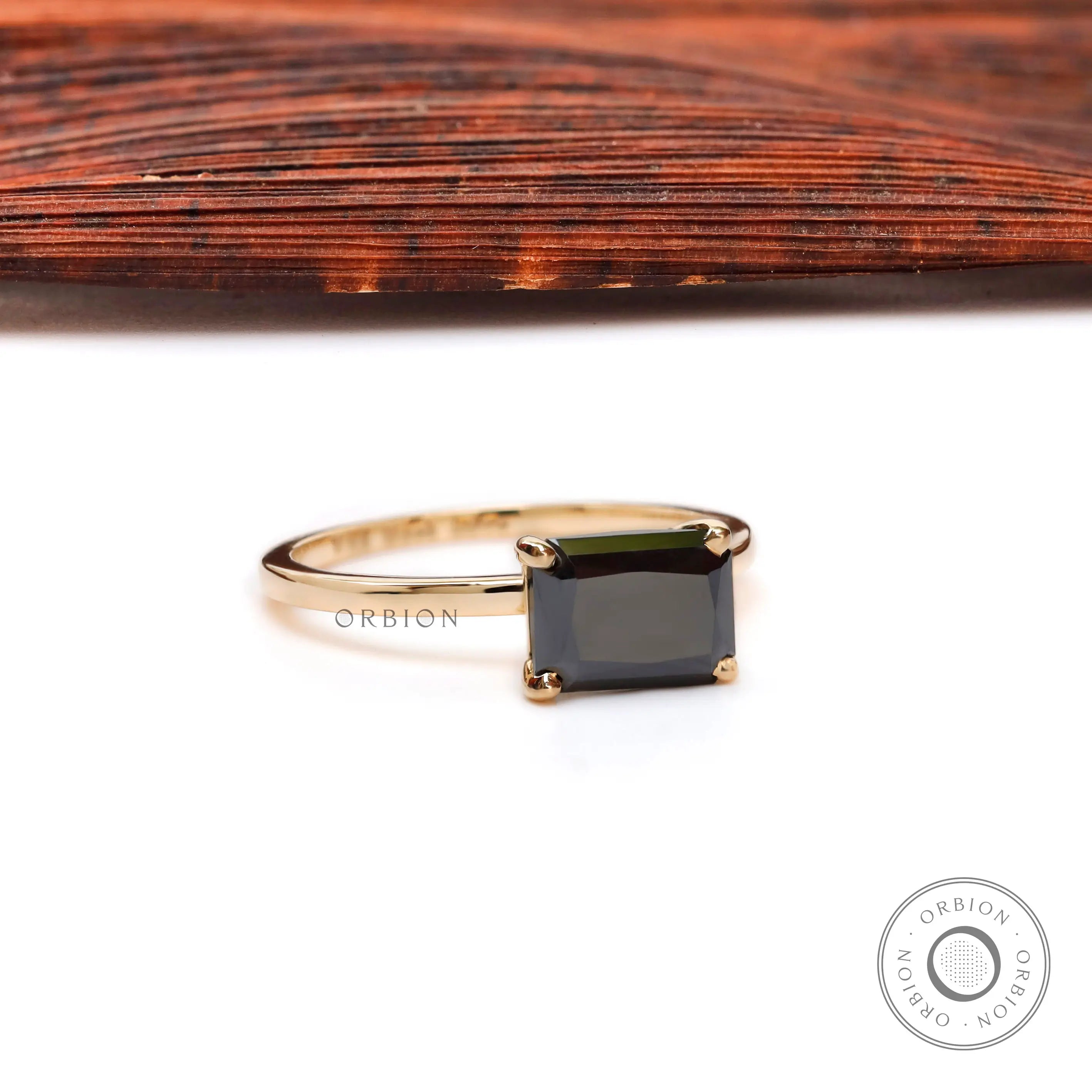 Side profile of radiant black moissanite solitaire gold ring