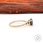 Radiant black moissanite ring viewed from angled side