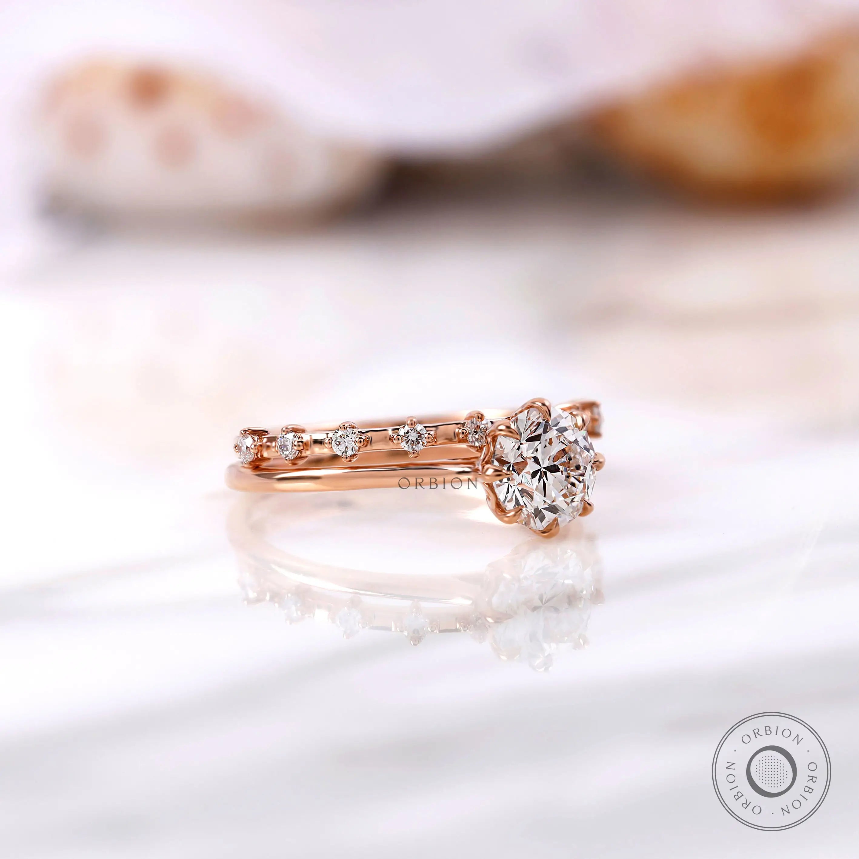 Cathedral engagement ring with diamond accent band