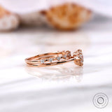 Cathedral style engagement ring with accent diamonds