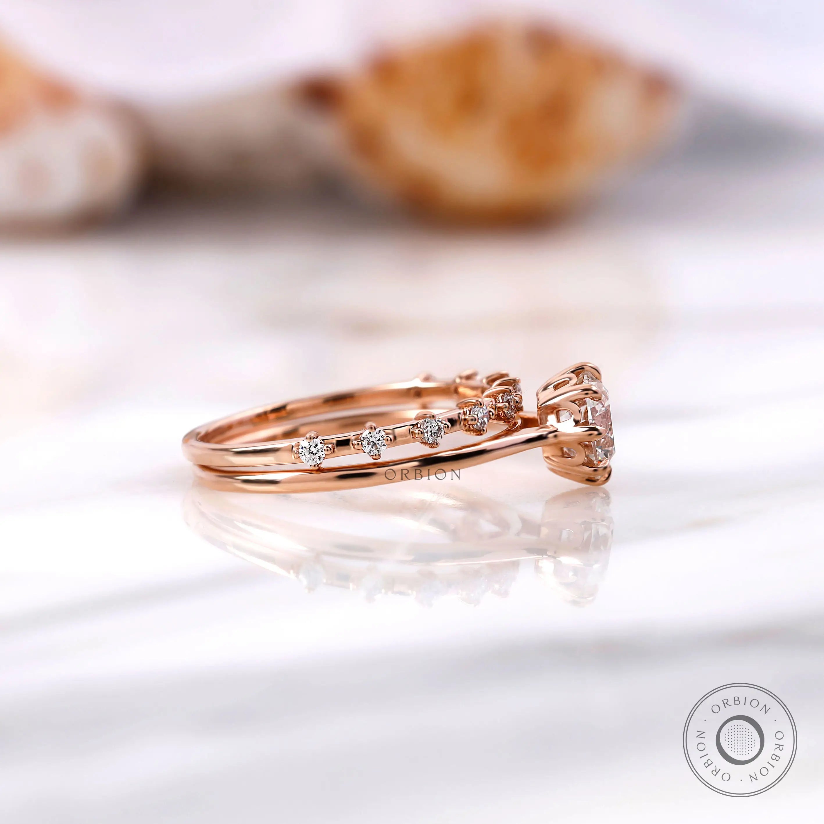 Cathedral style engagement ring with accent diamonds