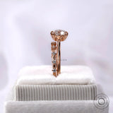 Cathedral style engagement ring with accent diamonds