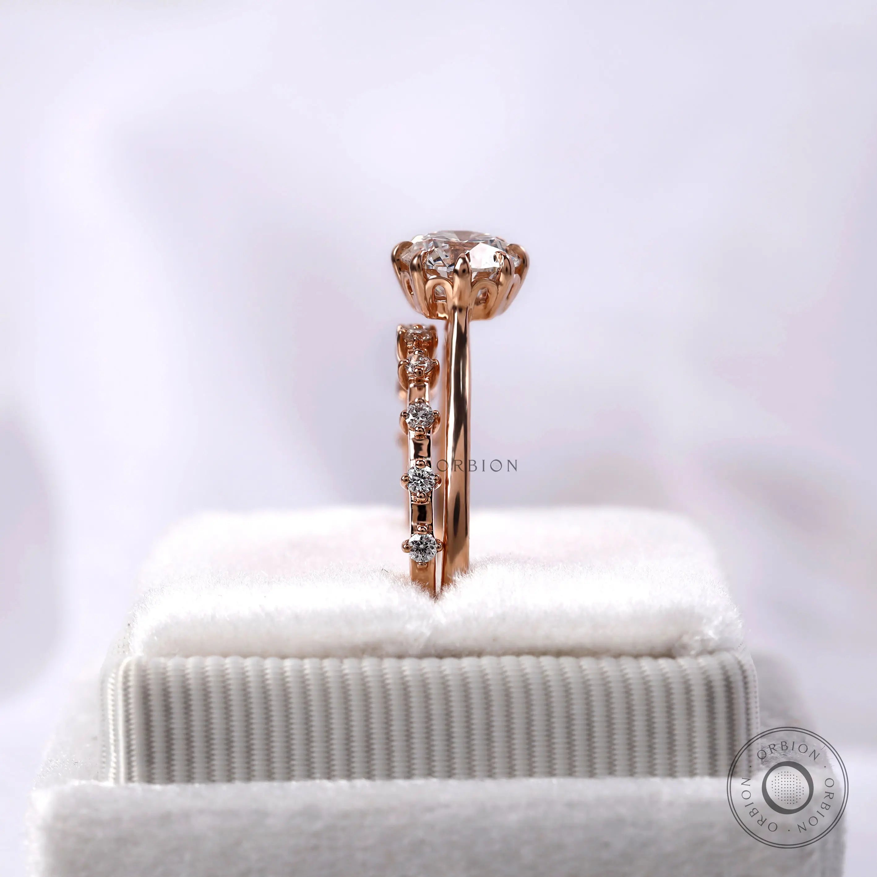 Cathedral style engagement ring with accent diamonds