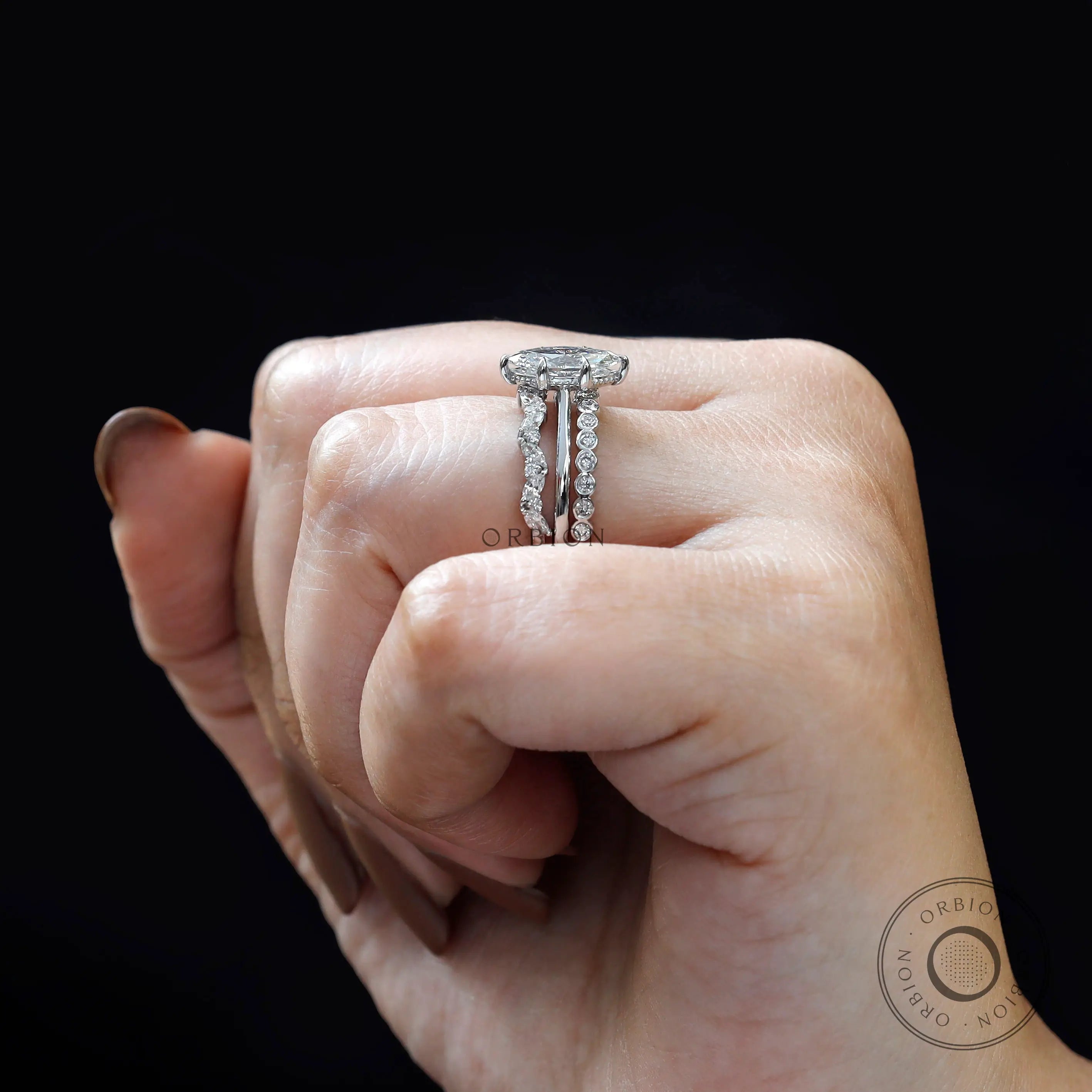 Close-up of marquise center diamond with accent stones