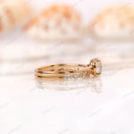 Side profile of round diamond engagement ring showing diamond accented band