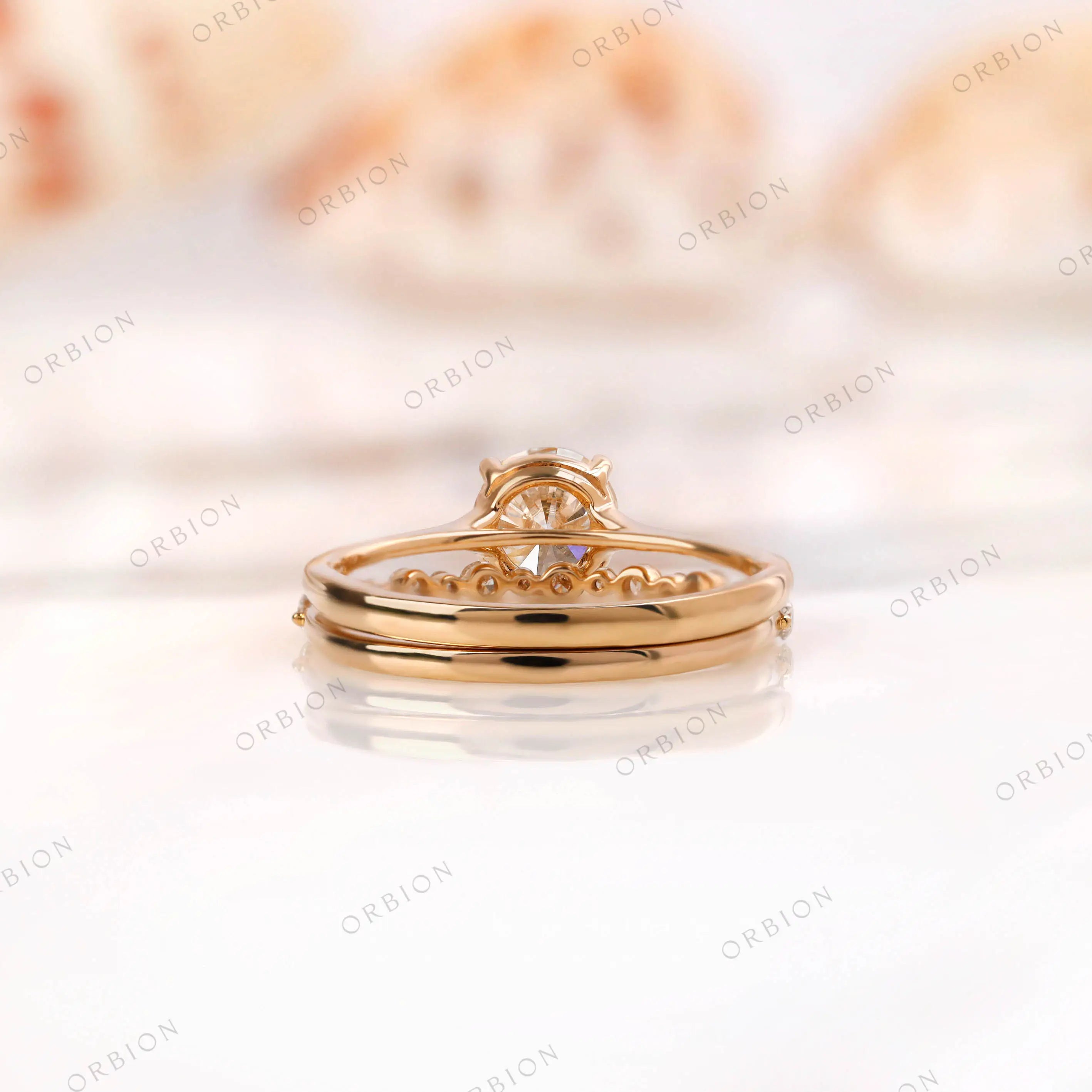 Back view of diamond engagement ring with polished yellow gold band