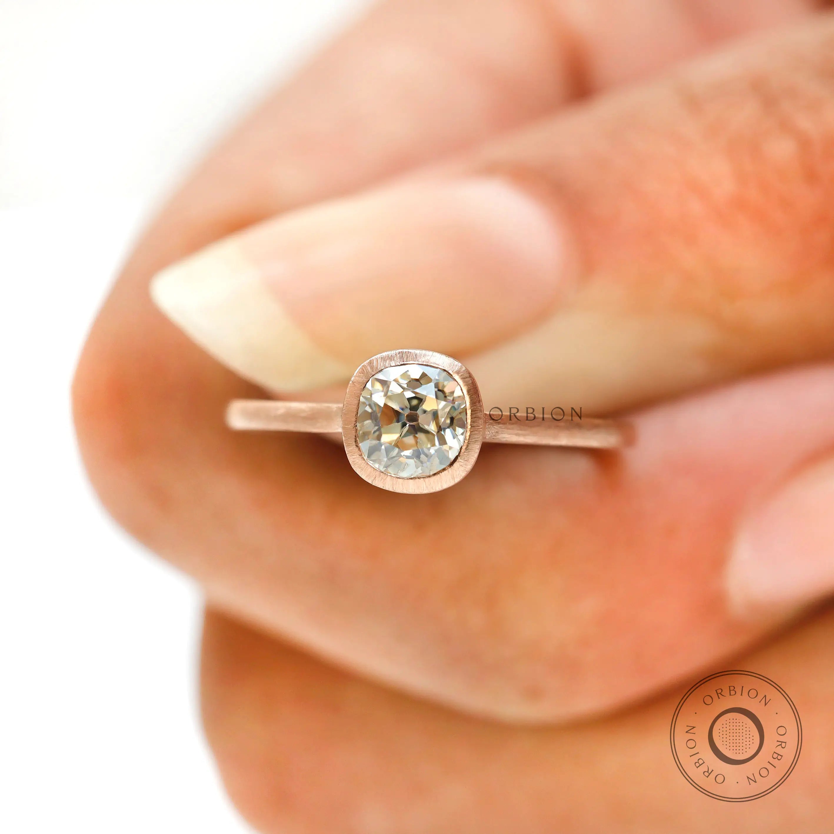 Matt finish Cushion engagement ring vintage style in hand