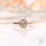 Cushion cut lab grown diamond bezel solitaire ring in 14K yellow gold front view