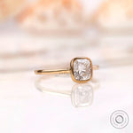 Minimalist cushion diamond solitaire ring angled view