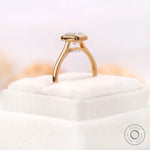 Low profile bezel setting highlighting cushion cut diamond
