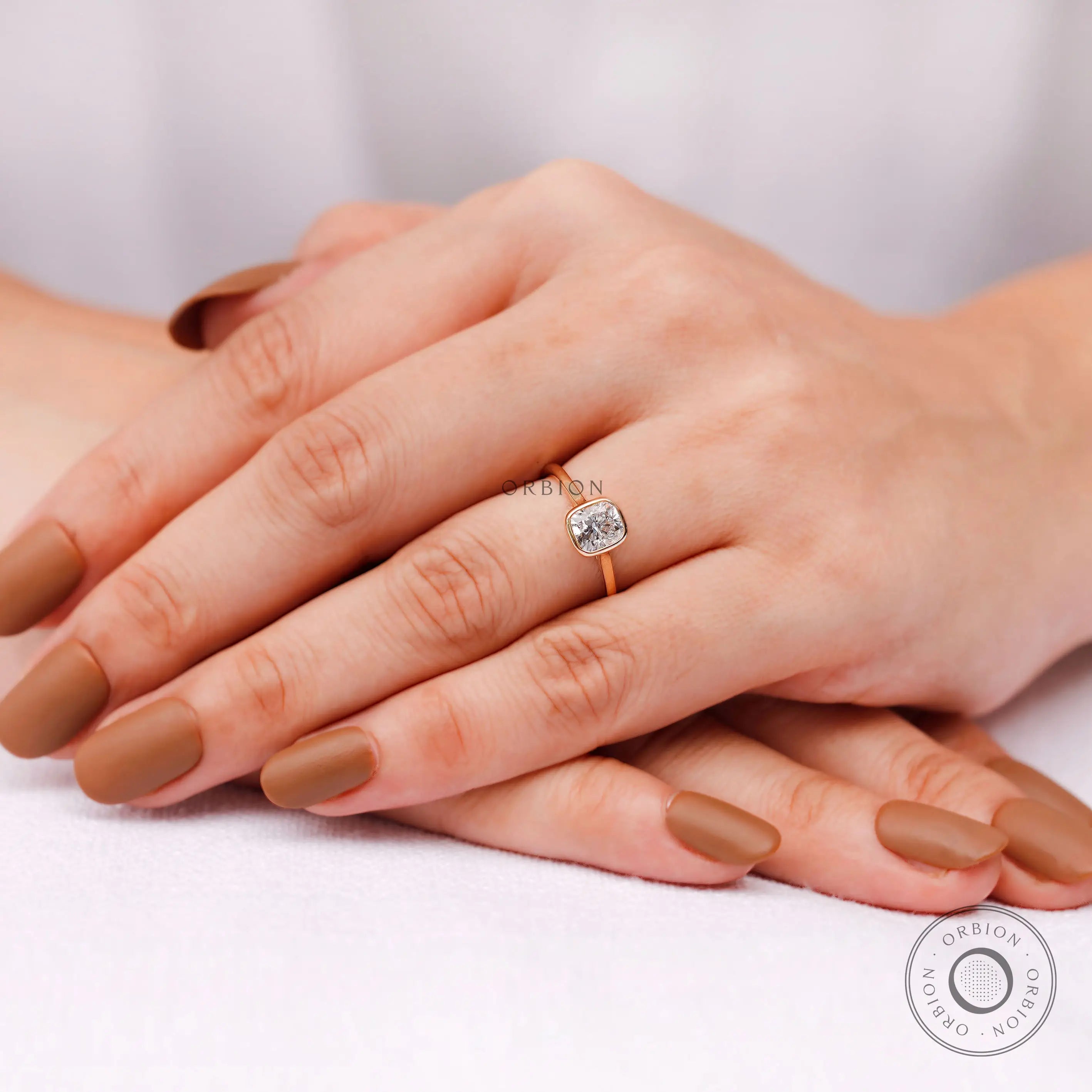 Cushion cut lab grown diamond ring worn on hand