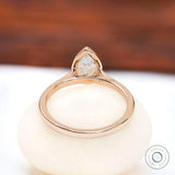Rear view of pear bezel cathedral solitaire ring