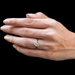Pear bezel cathedral solitaire ring worn on hand top view