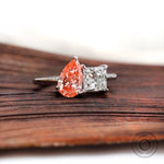 Pear pink diamond and white diamond ring top view