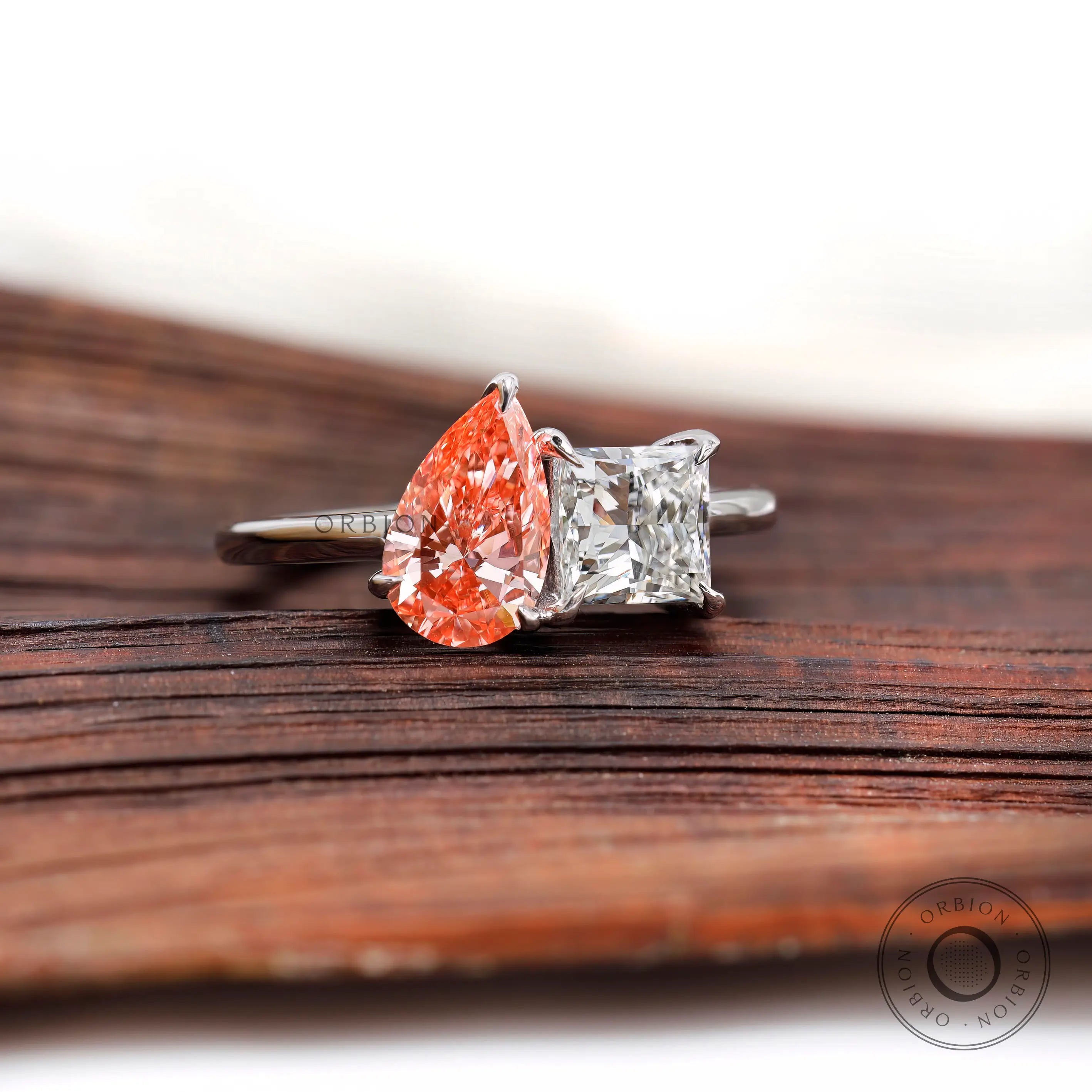 Pear pink diamond and white diamond ring top view