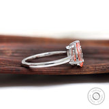 Pear pink diamond and princess diamond side view setting