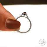 Grey moissanite bezel cathedral ring in hand