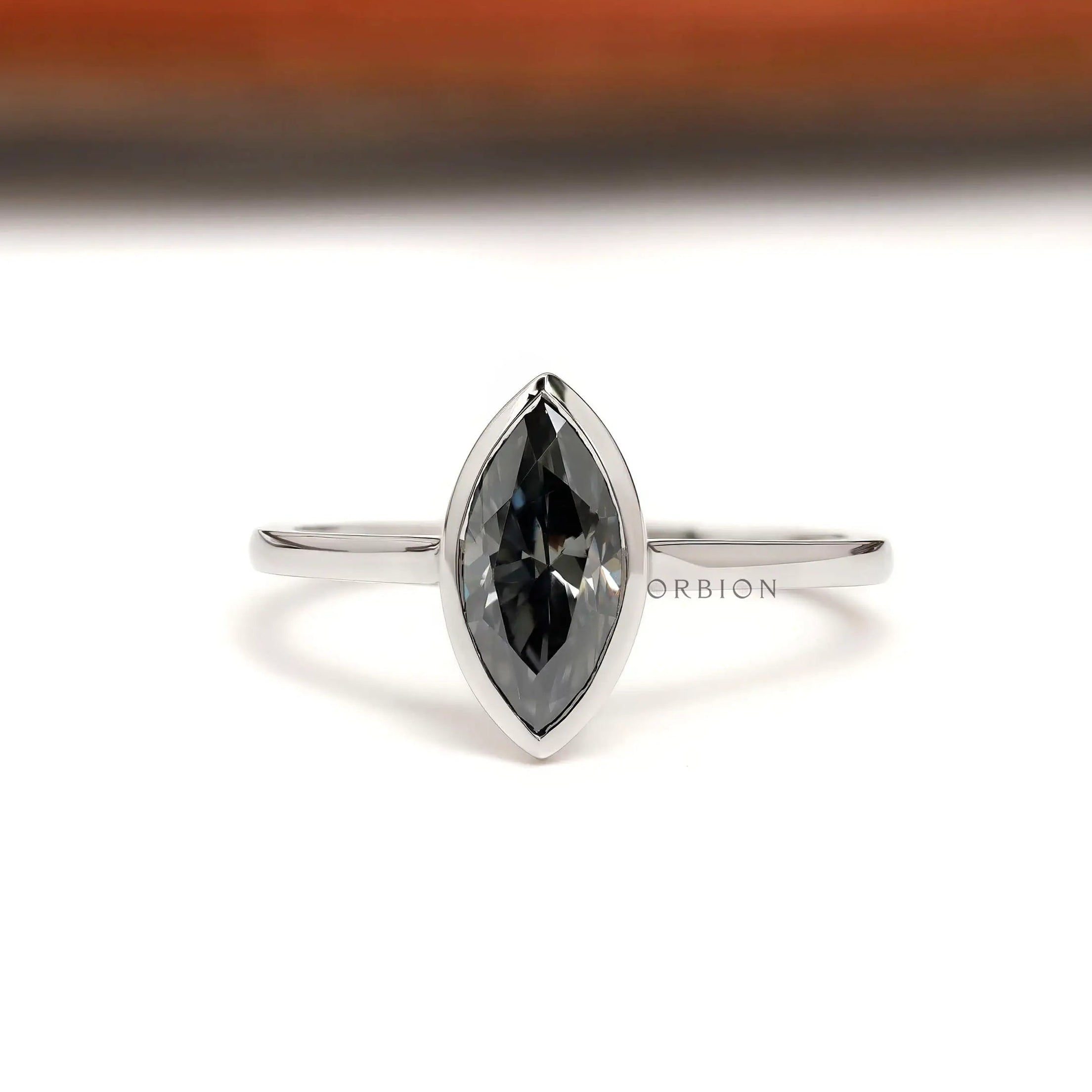 Marquise grey moissanite bezel set solitaire ring in 14K white gold front view
